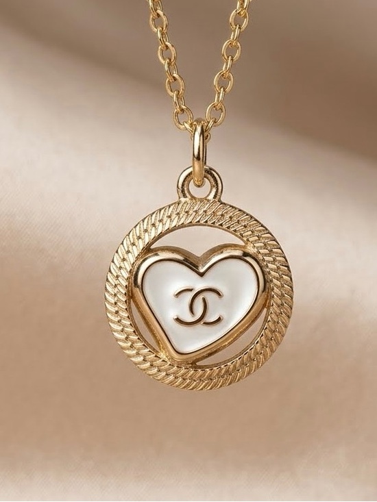 Chanel. Jewelry - ChaneI Gold Necklace with White Enamel Logo Heart Pendant